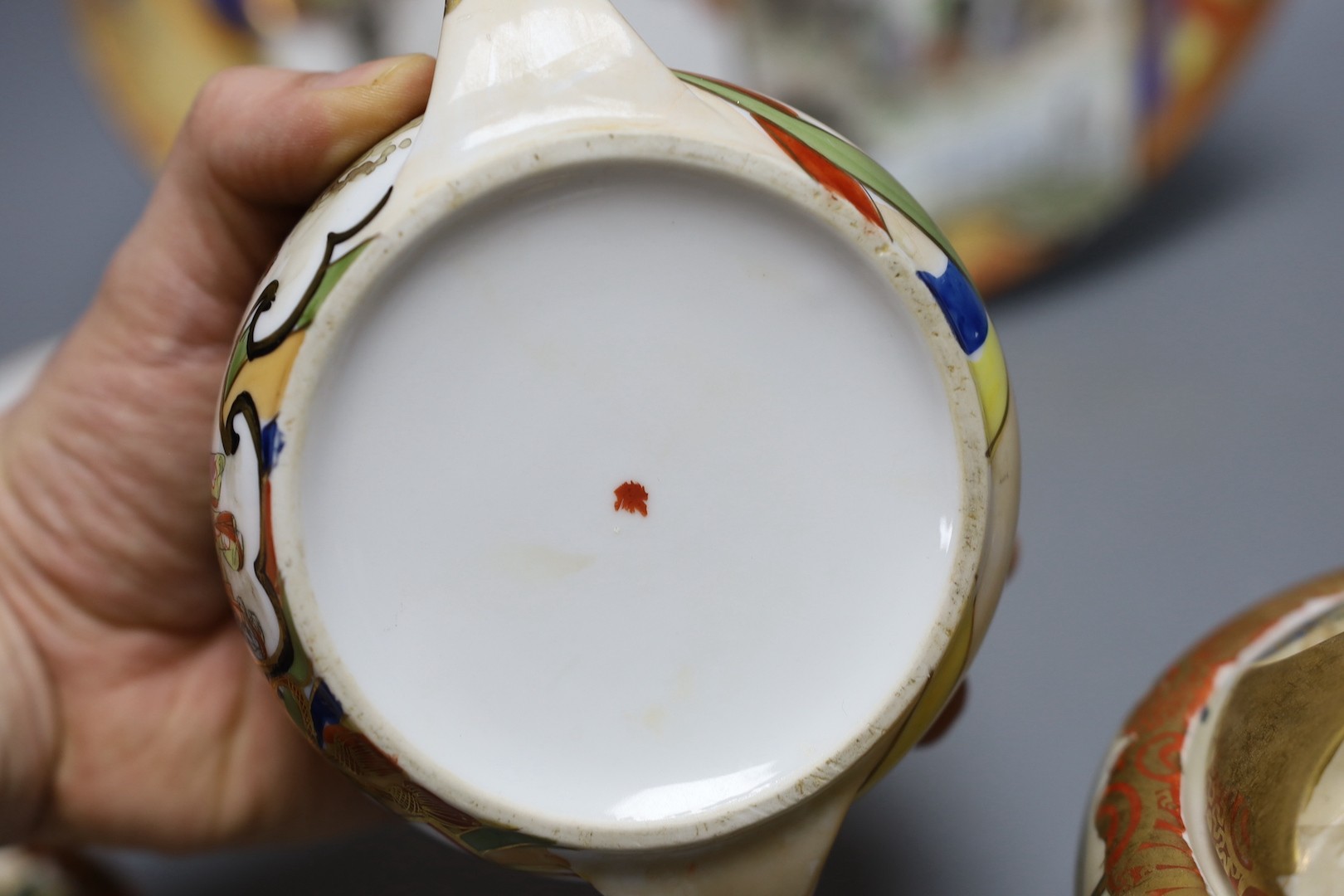 A Japanese Kutani porcelain teaset for 10 and a Japanese floral teapot